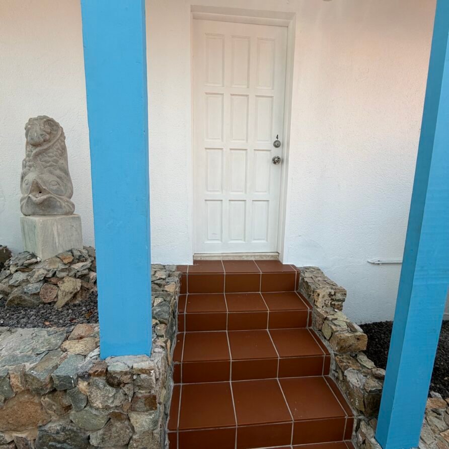 Private balcony with sweeping views of the marina, Caribbean Sea, and St. Barths.