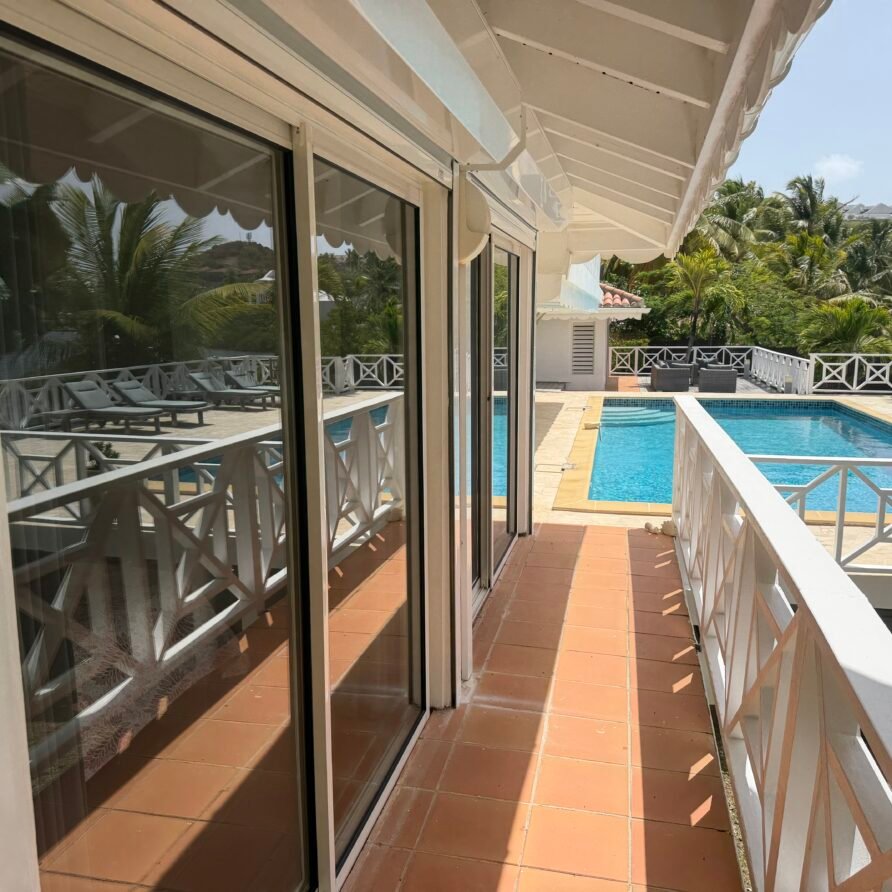 Private waterfront dock at Villa Coralita with views across Oyster Pond toward St. Barths.