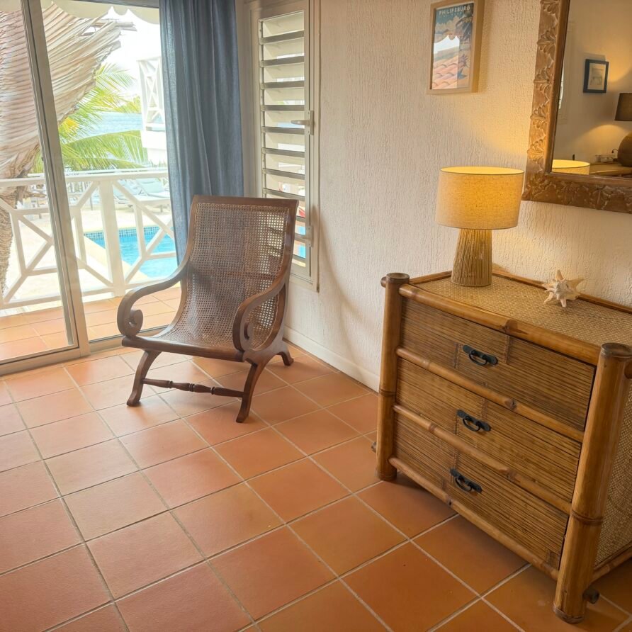 Villa Coralita exterior with private dock, swimming pool, and expansive Caribbean waterfront views.