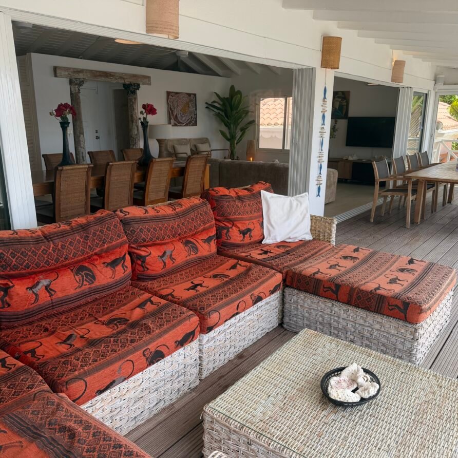 Villa Coralita exterior with private dock, swimming pool, and expansive Caribbean waterfront views.