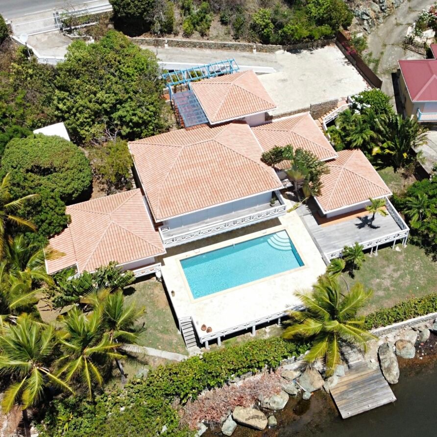 Private waterfront dock at Villa Coralita with views across Oyster Pond toward St. Barths.